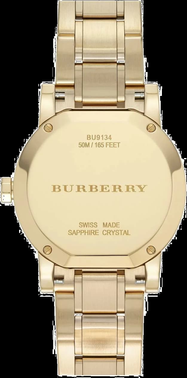 Visage cadran Burberry BU9134 présente index bâtons dorés et aiguilles dauphine, date à 3h