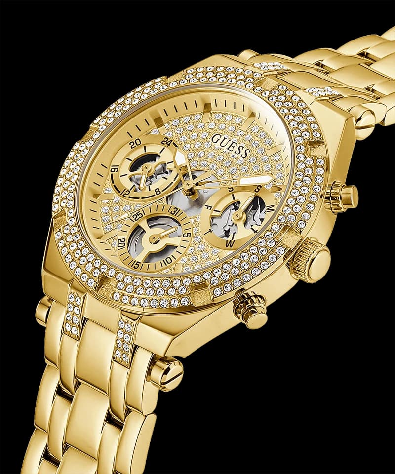 Visage cadran Guess GW0440L2 avec index appliqués dorés, aiguilles squelette et compteurs multifonctions sur fond ajouré
