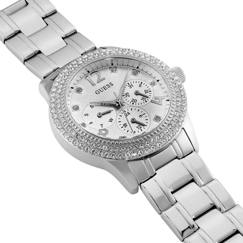 Visage cadran Guess W1097L1 avec index bâtons dorés, date à 3h