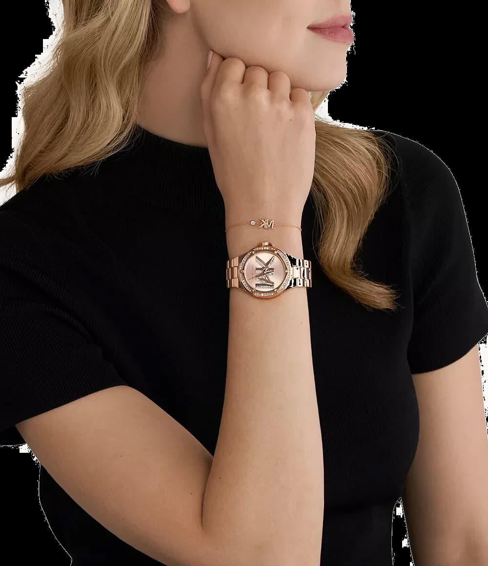 Lunette boîtier Michael Kors MK1063 en acier inoxydable poli or rose avec lunette lisse et verre minéral plat