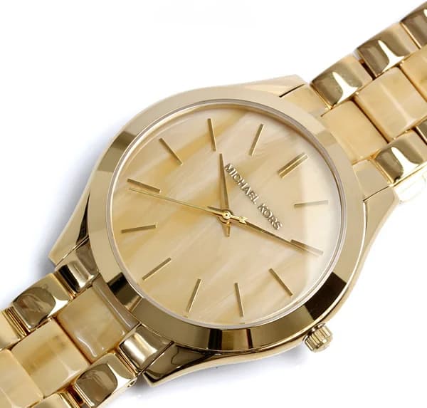Visage cadran Michael Kors MK4285 avec index bâtons dorés et aiguilles dauphine, guichet date à 3h