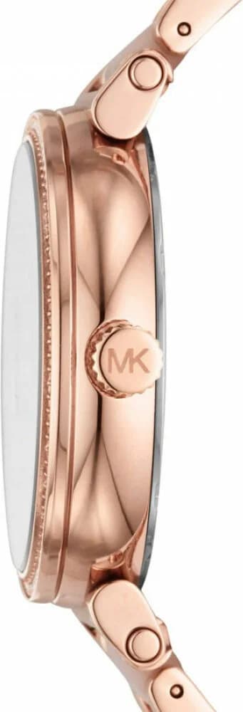 Visage cadran Michael Kors MK4336 détail des index appliqués polis et aiguilles dauphines, date à 3h, fond rose satiné