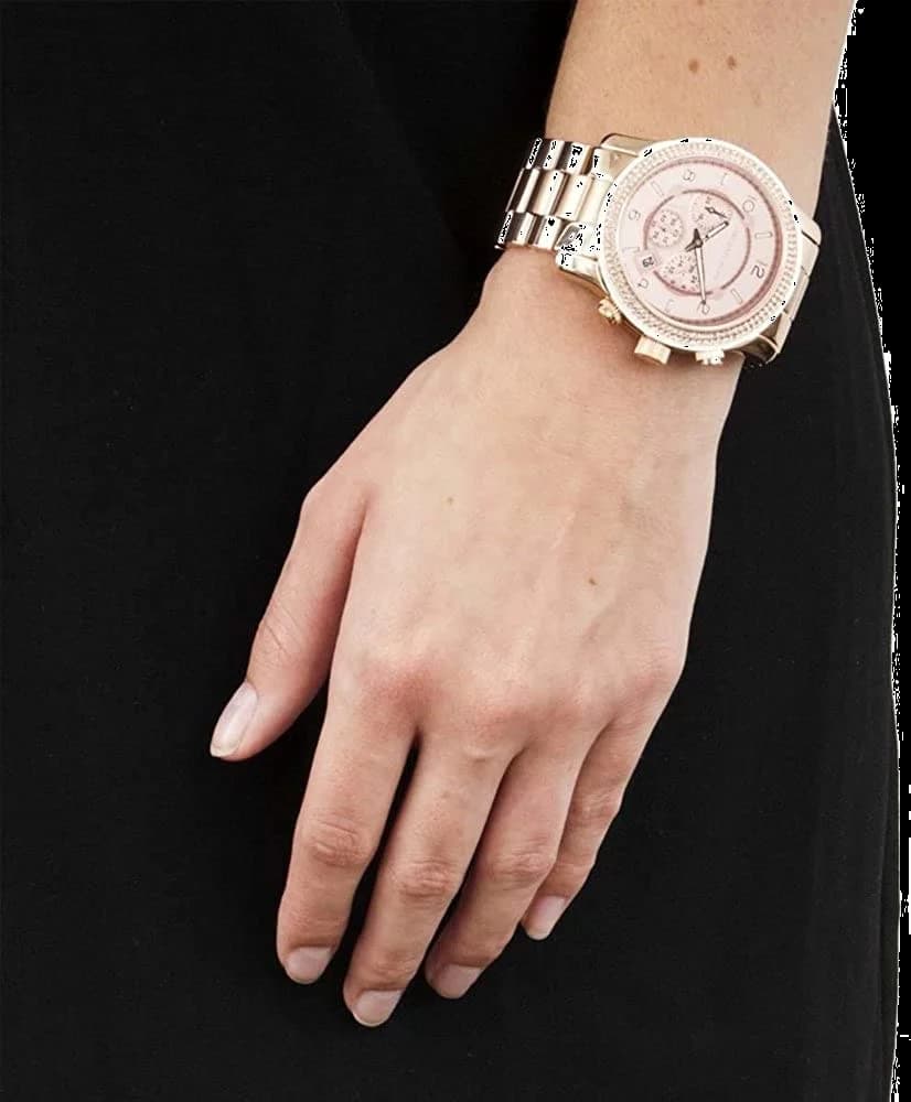Lunette boîtier Michael Kors MK5576 en acier doré rose sertie de strass, profil lisse et poussoirs intégrés
