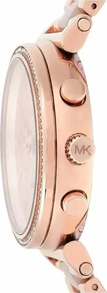 Visage cadran Michael Kors MK6560 dévoile aiguilles dauphine et date à 3h sur fond argenté