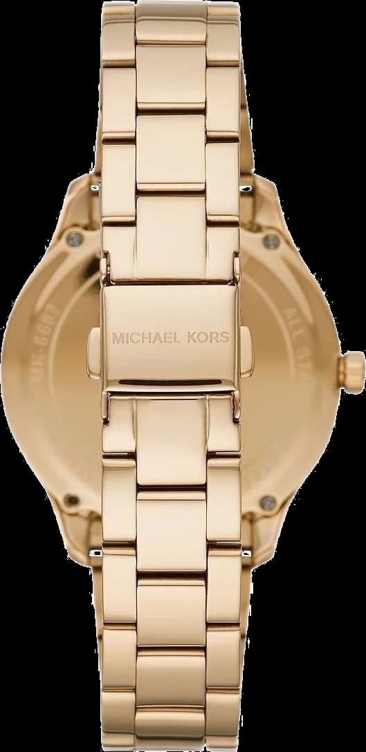 Visage cadran Michael Kors MK6682 dévoile index bâtons facettés, aiguilles dauphine polies et guichet date à 3h, fond gravé de motifs circulaires concentriques