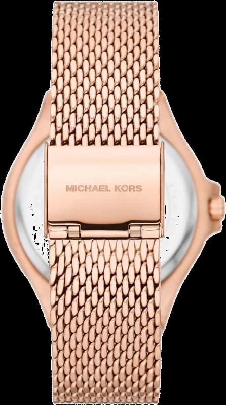 Visage cadran Michael Kors MK7336 dévoile index appliqués et aiguilles dauphine en or rose, fenêtre date à 3h sur fond soleillé