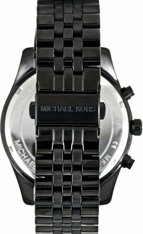 Visage cadran Michael Kors MK8603 noir avec index appliqués dorés, aiguilles bâtons, guichet date à 4h30, mouvement quartz précis