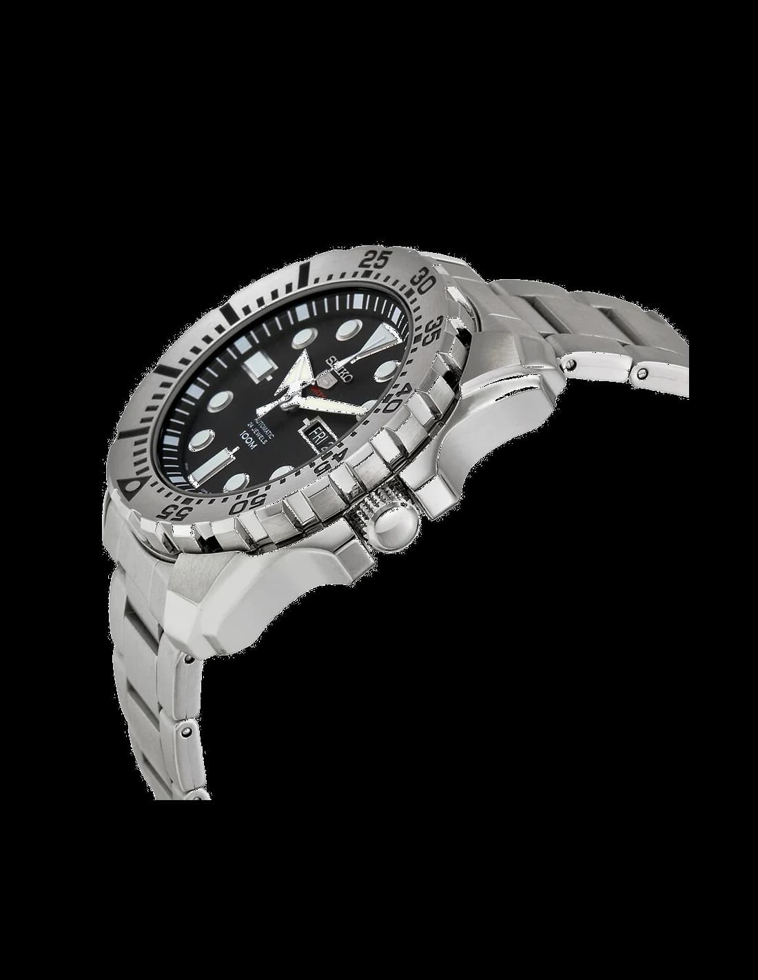 Visage cadran Seiko SRP599J1 révèle index bâtons polis, aiguilles dauphine, guichet date à 3h, finition grainée