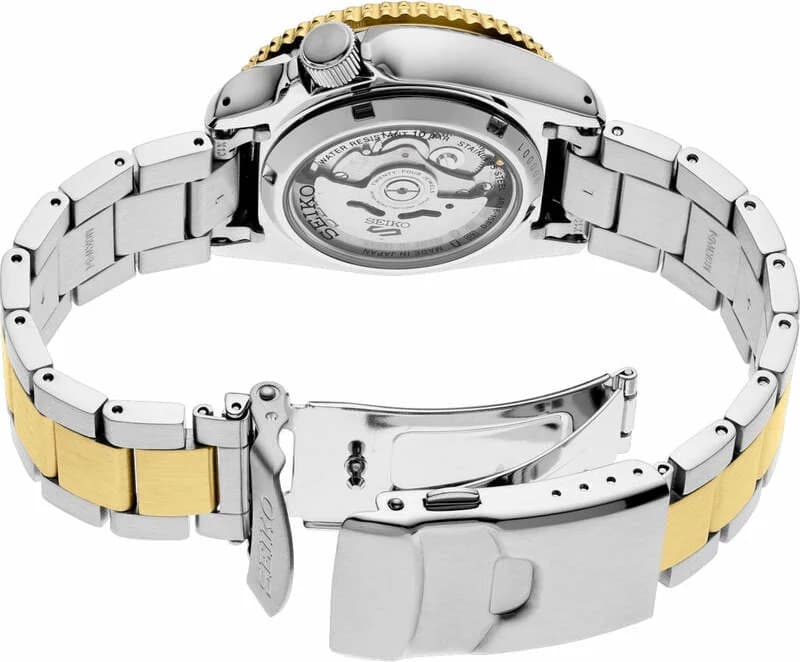 Visage cadran Seiko SRPK24 marron soleil aux finitions radiales, aiguilles et index traités LumiBrite, guichet date à 3h avec loupe cyclope