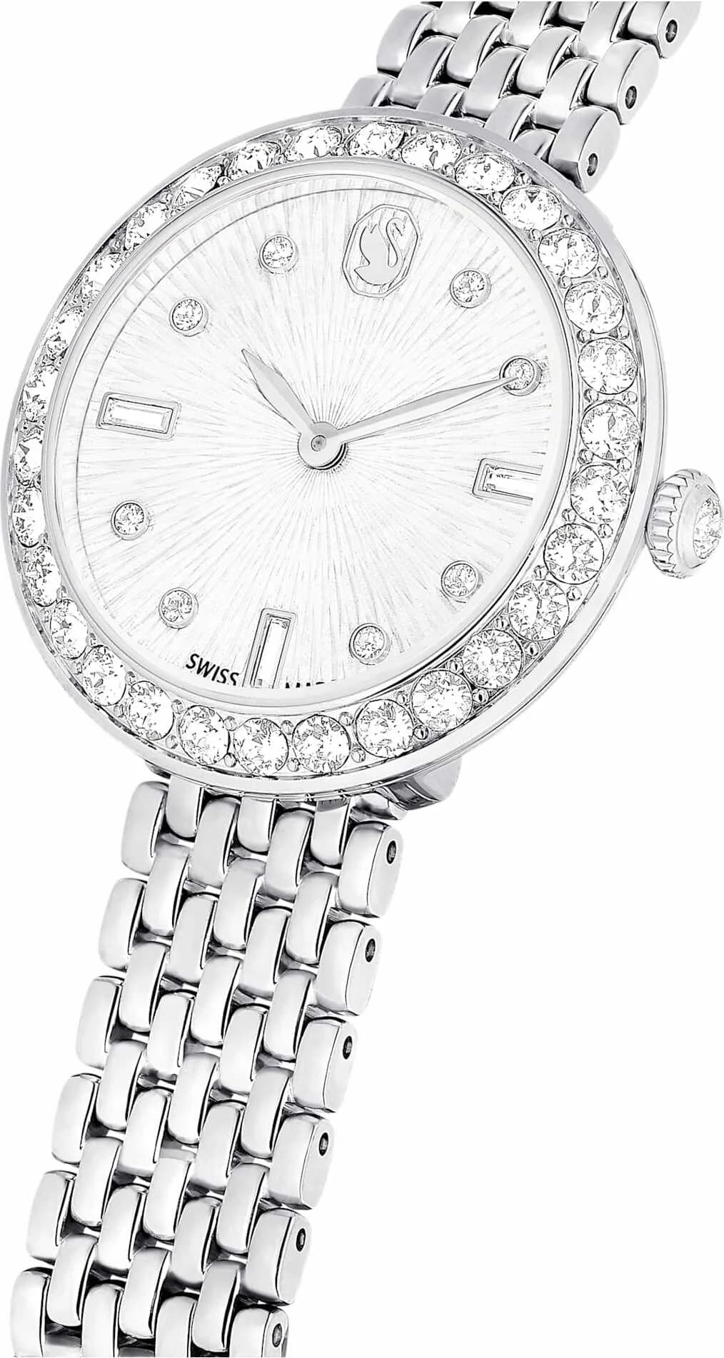 Visage cadran Swarovski 5673022 avec aiguilles facettées et guichet date à 6h, index appliqués