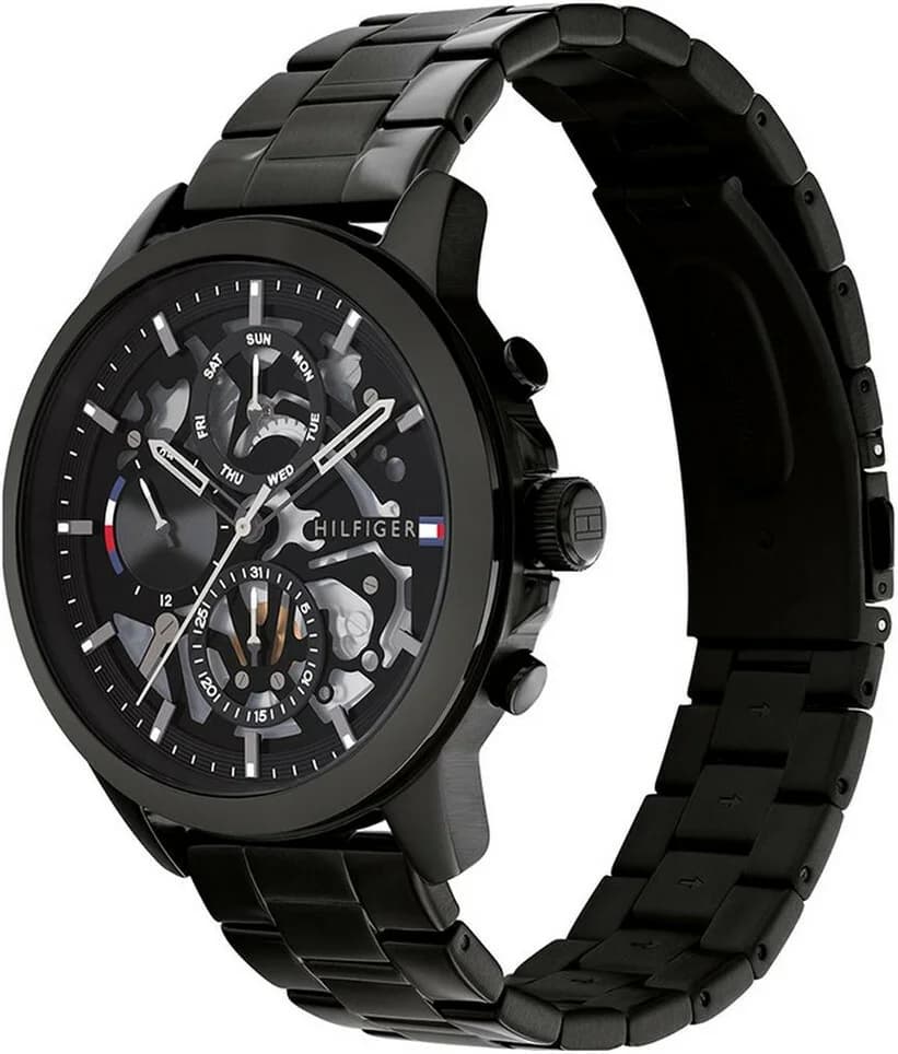 Visage cadran Tommy Hilfiger 1710478 dévoile un squelette audacieux avec aiguilles bâton polies et guichet date à 3h sous verre minéral