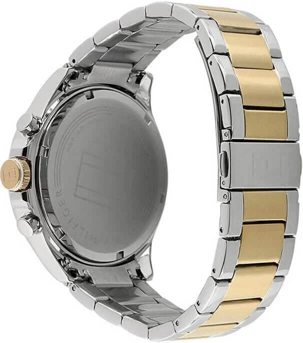 Visage cadran Tommy Hilfiger 1791226 dévoile index bâton argentés et aiguilles luminescentes pour lisibilité optimale, date à 3h sur cadran bleu soleil