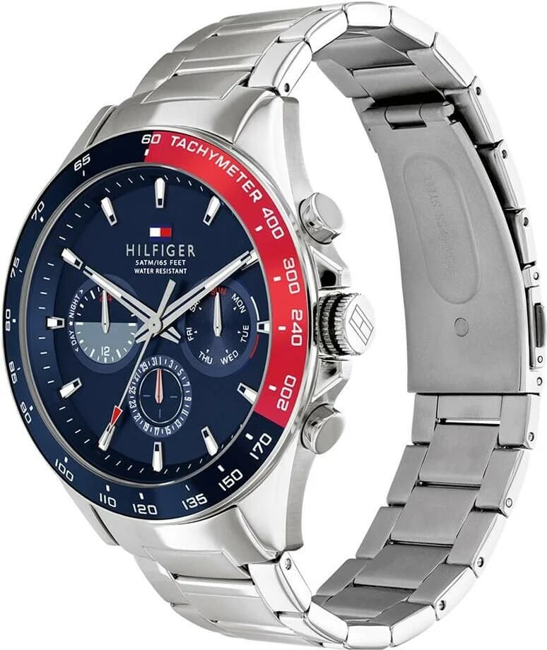 Visage cadran Tommy Hilfiger 1791968 avec échelle tachymètre, index appliqués polis, aiguille chrono centrale rouge, guichet date