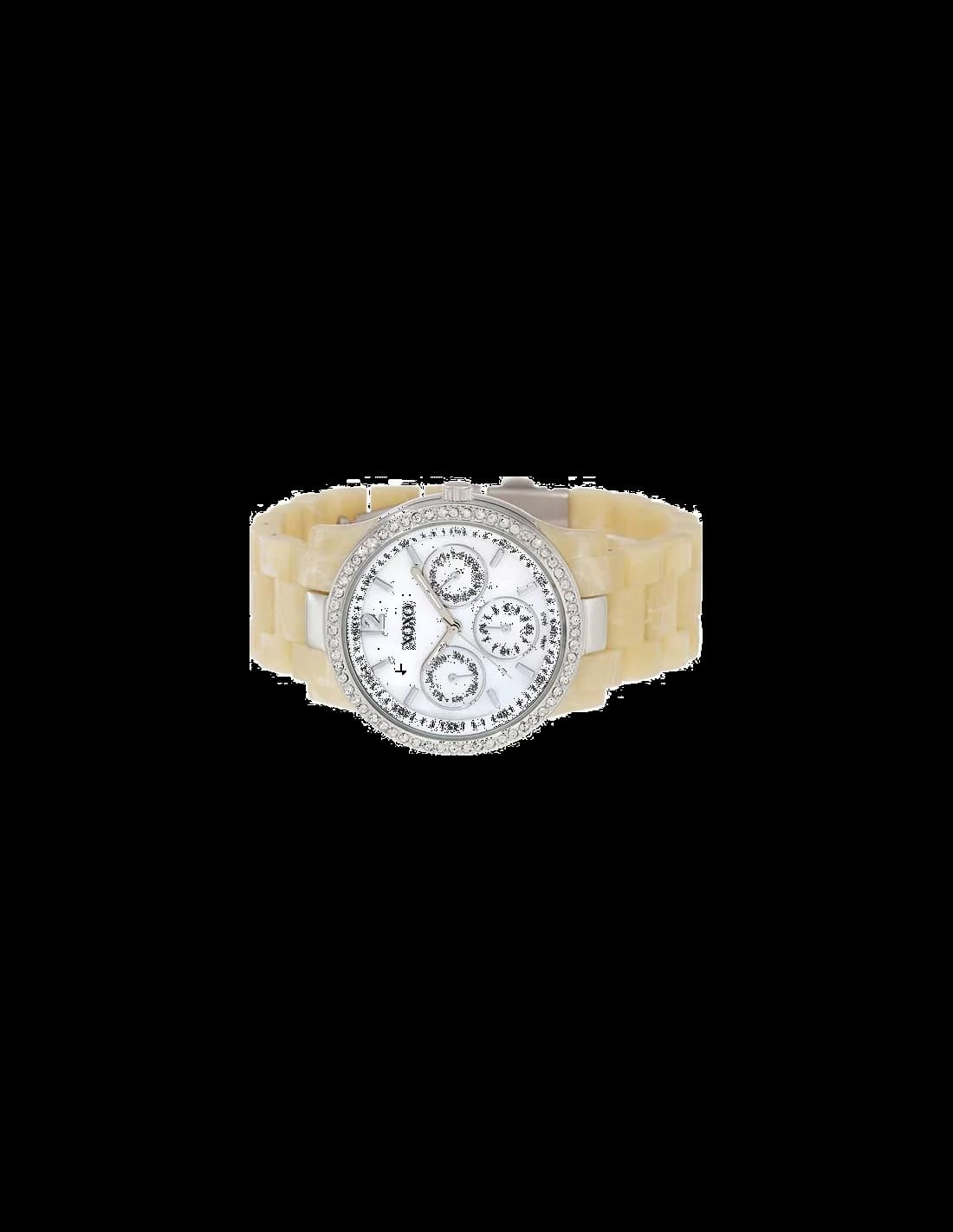 Visage cadran XOXO XO5523 avec chiffres romains noirs, aiguilles dauphine et guichet date à 3h, lisibilité optimale