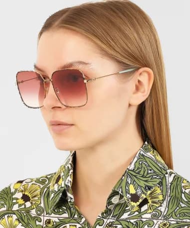 Lunettes de soleil Gucci GG0443S carrées en métal