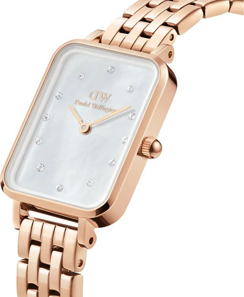 Visage cadran Daniel Wellington DW00100620 avec index baguette et aiguilles dorées, date à 6h, finition nacre lumineuse