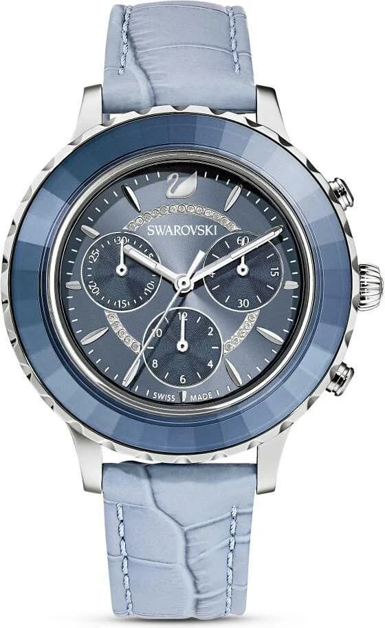 Garde-temps Swarovski 5580600 avec cadran blanc nacré, index cristal et aiguilles rhodiées sur fond bleu