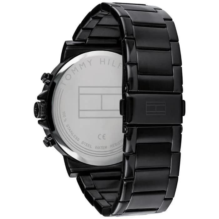 Attache bracelet Tommy Hilfiger 1710383 en acier noir PVD, maille milanaise souple, fermoir déployant double sécurité gravé du logo